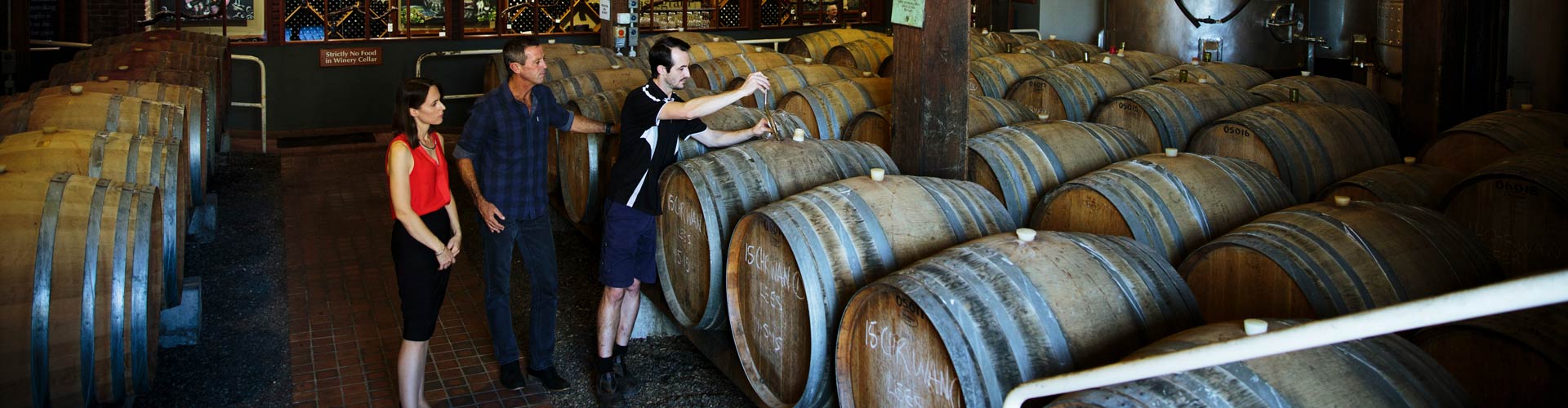 Couple enjoying a winery tour at Cassegrain's onsite modern, purpose-built facility for wine production in Port Macquarie