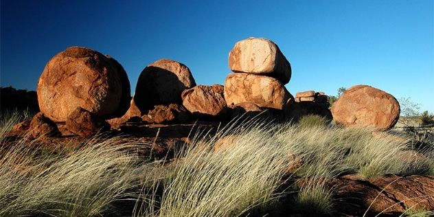 grasses and unusual stacked rounded boulders called devils marbles