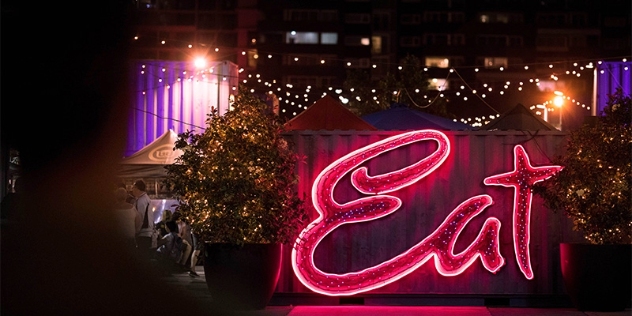 eat street neon sign at night