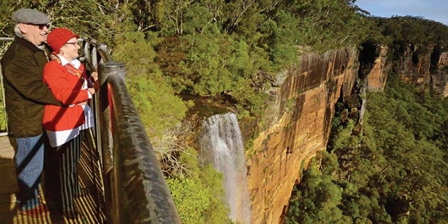 couple looking at the Fitzroy Falls waterfall