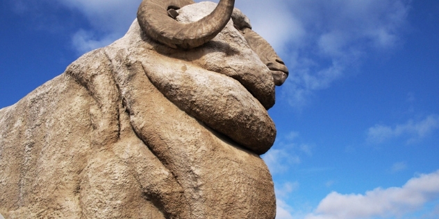 close up of the side of the Big Merino monument on a clear day