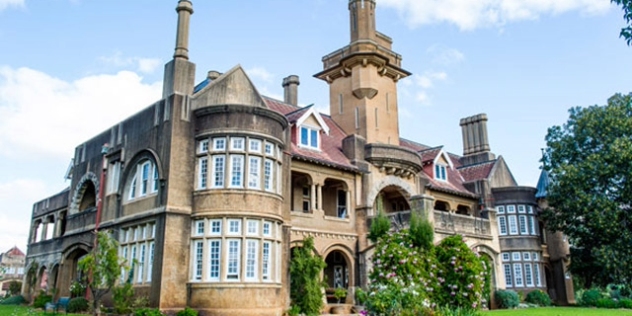 front-left view of stately home with central turret