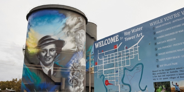 tourist map charts route and information of the hay water tower art with a colourful painted water tower with anzac behind