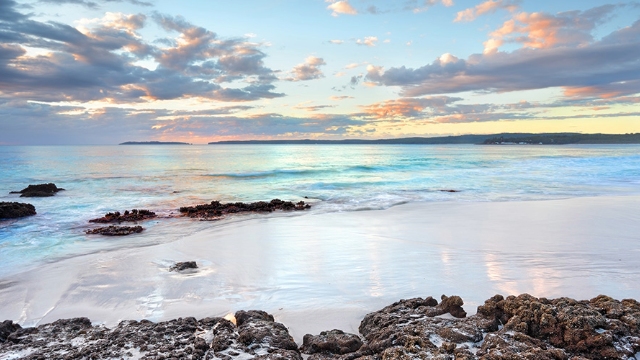 Jervis Bay NSW beach early evening early evening view of jervis bay with volcanic rocks on the shore and white sand
