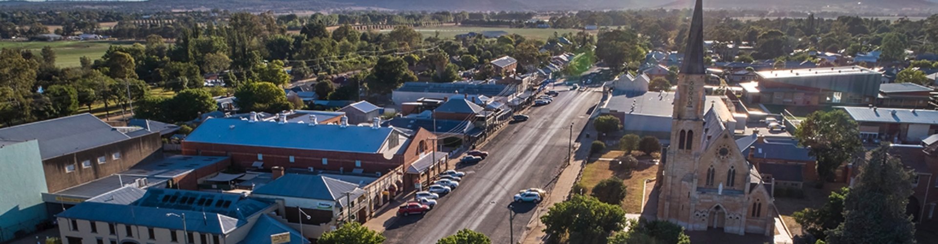 Mudgee streetscape arial view NSW arial view of Mudgee with church and a mix of historic and modern shop fronts
