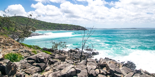 view of waves breaking against the coastline