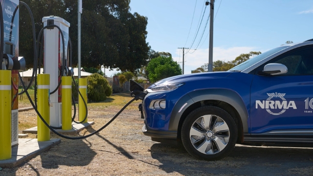 NRMA Wilcannia Charger NRMA EV side view of a blue nrma electric vehicle charging at the nrma charging station in Wilcannia