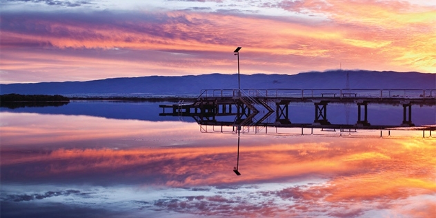 Colourful sunset reflected in the water at Port Pirie jetty