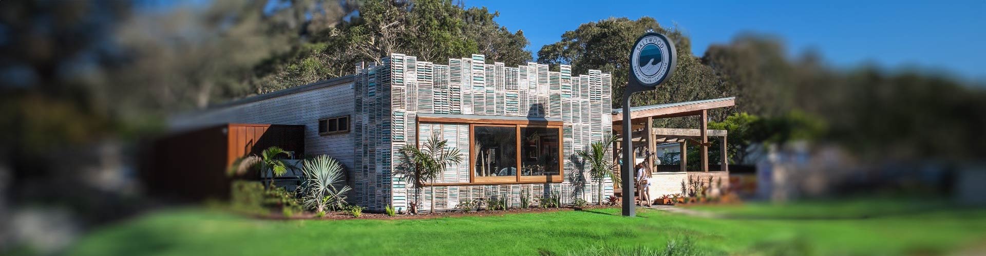 Building with louvre panels covering the outside in a bush setting