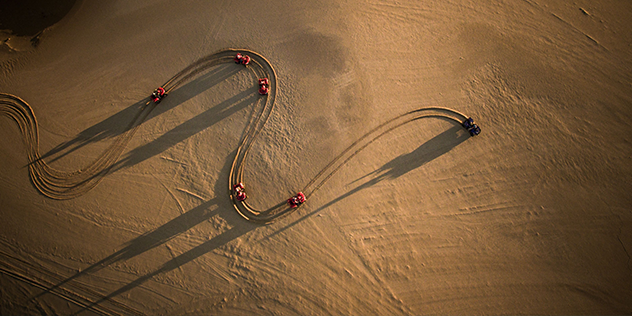 an Ariel view of Atv's on sand dunes