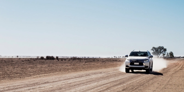 car driving along dirt road at Tilpa NSW