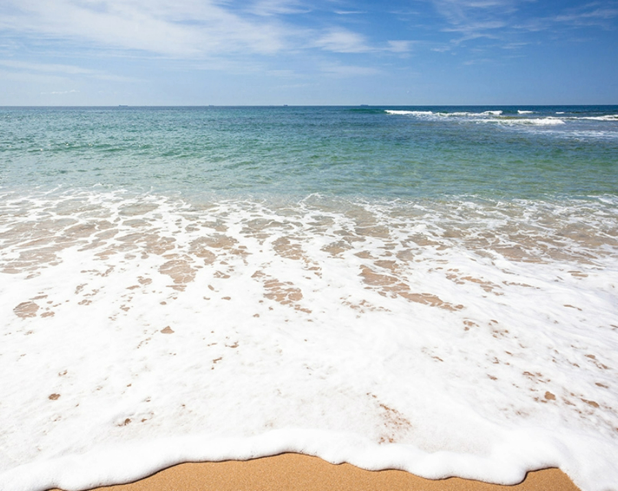 sea-foam-over-sand-900x715 Slide 2