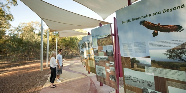 Couple looking at visitor information at Seymour light horse memorial park VIC