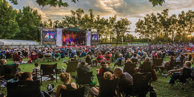 crowds seated on camp chairs enjoying the Tamworth Country Music Festival in 2017