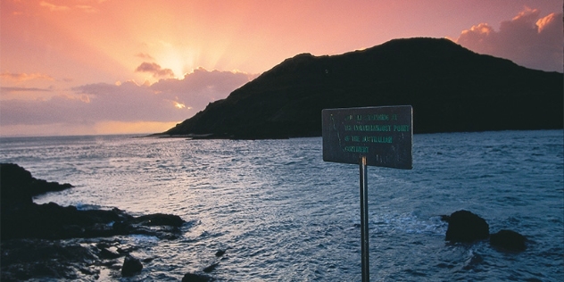 sunset at the tip with sign indicating the northernmost point of the Australian continent