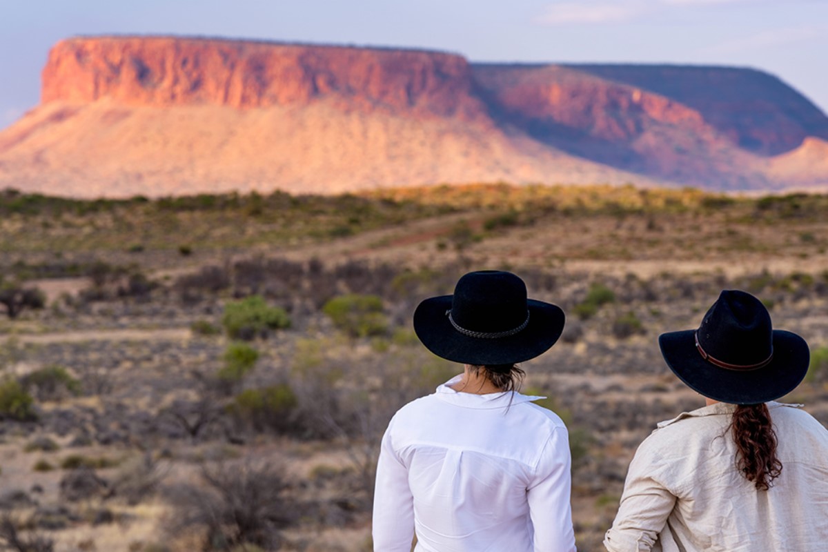 two-women-at-uluru-nt-1200x800 Slide 2