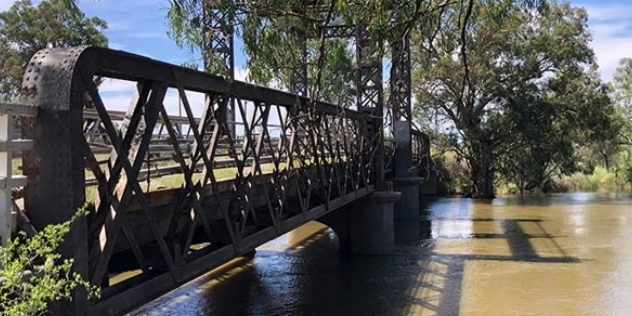 heritage steel bridge with lattice patterned supports and rivets