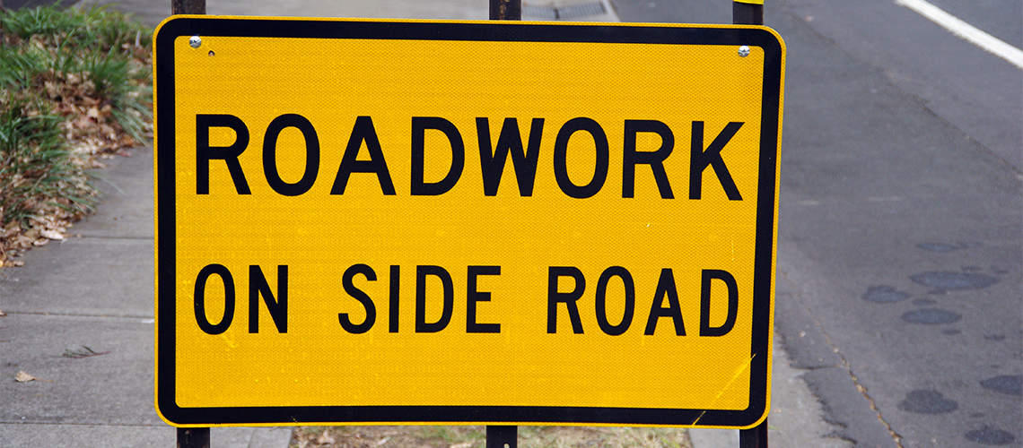 Roadwork on side road sign