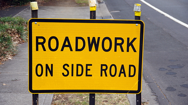 Roadwork on side road sign