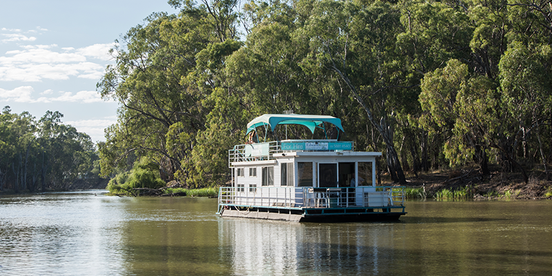 An Edward River Houseboats vessel along the scenic Edward River in Deniliquin.